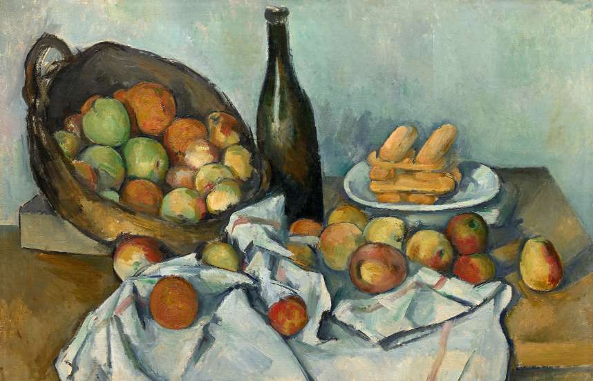 A still life painted by the artist Paul Cézanne depicts a simple scene of a table with fruit spilling from a basket onto a cloth, bread on a plate, and a bottle of wine.